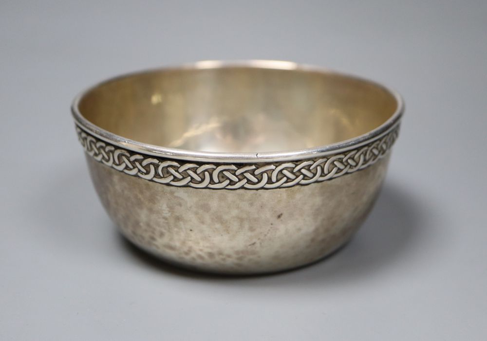 A George V Arts & Crafts Liberty & Co silver bowl with Celtic style border, Birmingham, 1930, diameter 10.5cm, 141 grams,